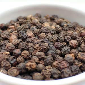 Black peppercorns in a dish