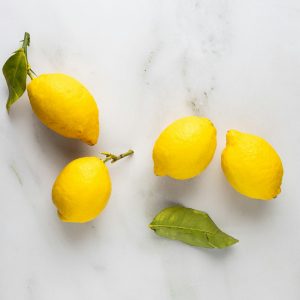 Lemons and leaves on marble
